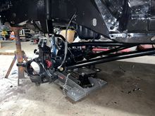 Front axle and control arms installed 