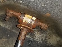 both shocks were like this. one factory welded nut and one replacement bolt. much to my surprise everything came loose. then I air hammered the welded nuts out