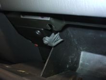 2.  Remove both rubber stops