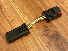 Here is what I meant. Cut the wires then turn the red tab connector facing down, then connect the wires straight across. Purple to brown, yellow to white, white to yellow, brown to purple. 