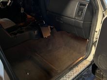 Wet floorboard update: carpet is dry and back in place. I did some more leak tests with the hood closed and no more water has gotten in! 