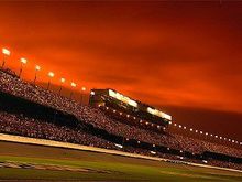 Sunset at Daytona, July Busch Race, 2004. I snapped this off from our pit stall right before the race. We dodged the big one with a little RF fender rub, but ended up getting taken out by Kenny Wallace in some hotshot, banzai move.