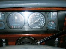 Speedo, shifter and switches look weird to you? Remember, this Jeep was a police rig and so Bare-Boned that it looked like it had been Car Jacked from a wrecking yard! 

Wood grained Bezel added form the Bone-Yard.