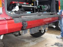 The bumper fits right over the lower cross member and ends up about 1/8" closer to the body than factory. The only way you can tell is when you look closely at the bumper caps.