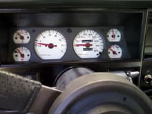 White gauges from whitegauges.net. The turn indicators are also now red by replacing the green film with trimmed and glued red reflectors on the back side.