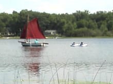 My stepdad's sailboat... And yes, he is pulling my sister and her friend behind him