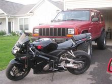 My 2006 Honda CBR600RR in front of my '98 XJ