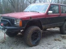Rough Country winch, bumper, bull bar &amp; D rings.  Also got the 32" tires on it.