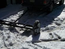 Here's the tow dolly me and my buddy built from scratch.  It was the ultimate design of lightweight and compactness, yet exceptionally strong. Notice I speak of it in past tense, due to the fact that some idiot ran it over while I was going about 35 mph. It got a little mangled, so I had to leave it while we went to get the truck so we could through it in the bed. Then someone stole it! What a day.