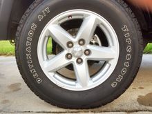 Front Tire and Rim with New Drilled and Slotted Rotors. Calipers and Ceramic Pads.