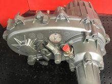 Humvee NP242AMG transfer case with the 4 bolt rear retainer housing with the speedometer gear provision