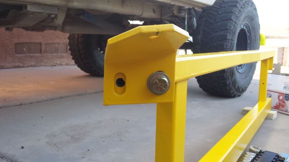 Installing the adjustable mounting tab on the front.