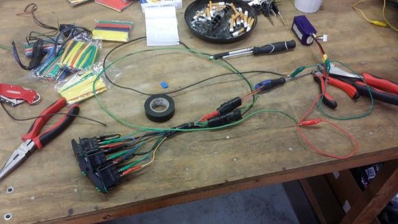 Bench top test of the harness. One connector goes to my radio harness, the other goes to the engine bay