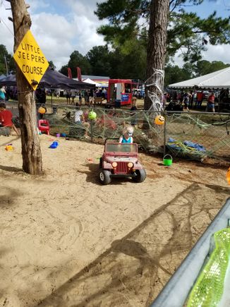 Play area for the kids. I included these not to bore you with pics of my kids, but so you could see the huge vendor section in the background lol