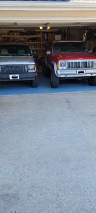 My wifes Silver 96 XJ Automatic, my 88 XJ with 3" lift and 31 x 15 Cooper tires, 5spd, two door. The 3" lift brand is Rough Country, I didn't want any cut away done but the front lower part of the fender guard was trimmed a tad for tire clearance.