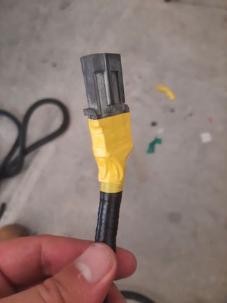 I wrapped the ends from the coorogated tubing up to the back of the connector with electrical tap to attemp to make more of a water resistant transition. I used yellow because some of the other plastics were already yellow so it seemed fitting.