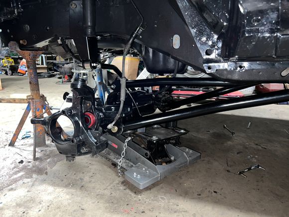 Front axle and control arms installed 
