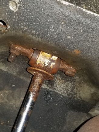 both shocks were like this. one factory welded nut and one replacement bolt. much to my surprise everything came loose. then I air hammered the welded nuts out