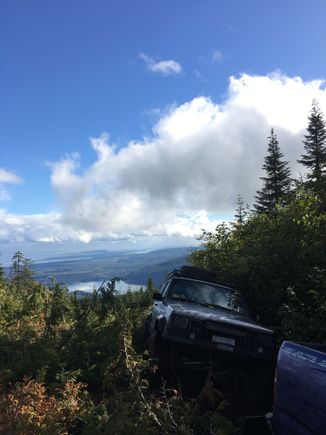 Making it to the top of the abandoned ski hill! Got to the chairlift at the top. Took a bit of a beating this day. Lots of narrow trees/brush. Took out a mirror and corner marker, and rear bumper cap. Lots of new scratches and found out my front driveshaft is on its way out. Slip part of it is loose. Loaded up with grease for now.