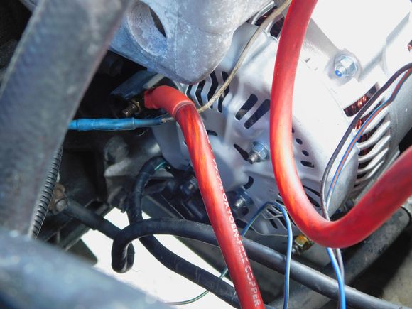This is my current alternator wiring.  See the main ALT GND?  Could I cut that, and instead of keeping it spliced to my main NEG GND to block wire, crimp a ring terminal to the end I cut, and fasten that straight to the GND location on the block?