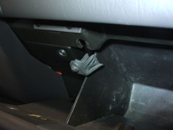 2.  Remove both rubber stops