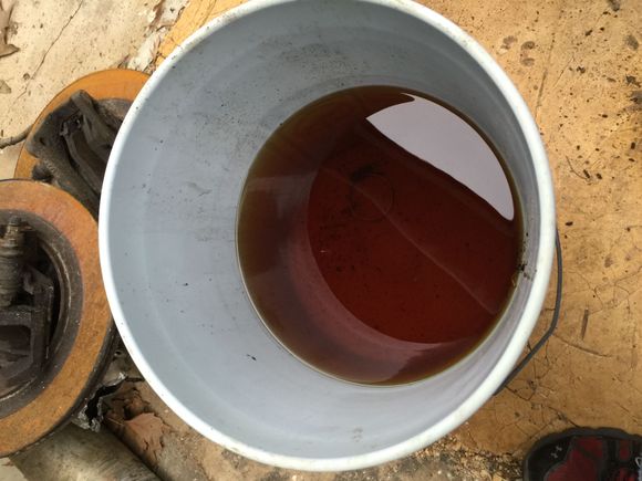 Dropped the tank and this is the state of the old fuel looks like I'll have some parts cleaner