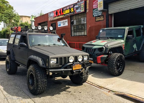 My XJ with the Line-X treatment next to the owner's wife's Jeep.
