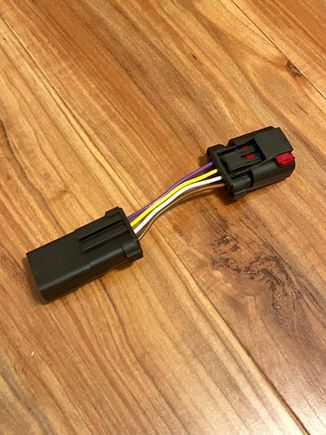 Here is what I meant. Cut the wires then turn the red tab connector facing down, then connect the wires straight across. Purple to brown, yellow to white, white to yellow, brown to purple. 