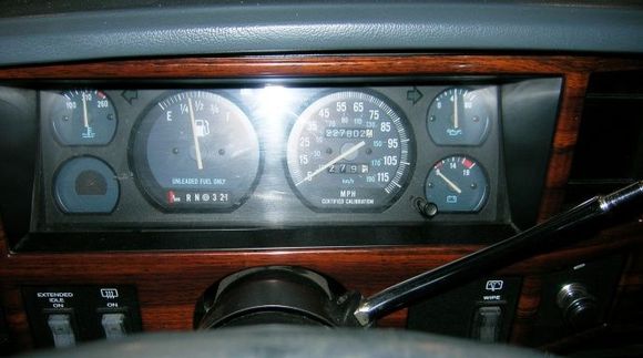 Speedo, shifter and switches look weird to you? Remember, this Jeep was a police rig and so Bare-Boned that it looked like it had been Car Jacked from a wrecking yard! 

Wood grained Bezel added form the Bone-Yard.