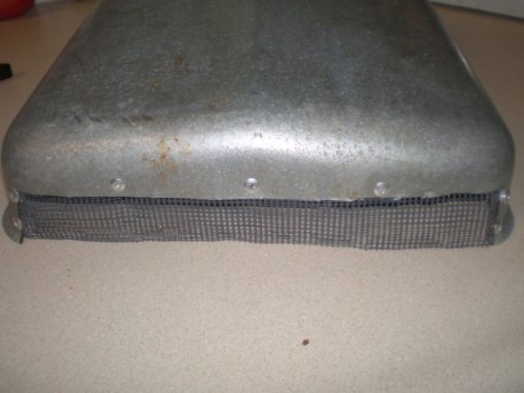 7.)  riveted in some screen (the screen came from the 8" vent that these were covering).  if i were to do this again, i would use some heavier screen, or small expanded aluminum or steel.