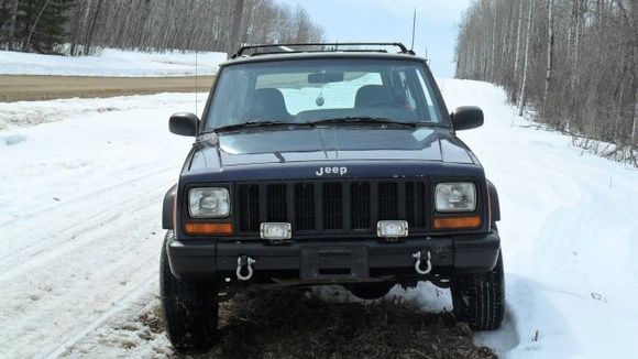 Got rid of some of the front bumper trim, homemade d-ring plates.
