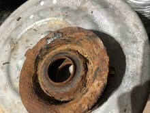 This is the top side where the plastic bearing lives , sandwiched in under the upper strut mount.
