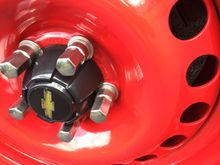 Red powder coating on stock steely rims, very smooth and glossy