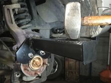 Like this hub buster , I recommend removing the axle nut first !