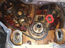 The sprocket by that red circle 