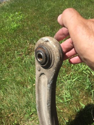 This is the top side, the bushing is pressed up and out, the new bushing presses in from this side, it has a taper or bevel to start it into the LCA, the hole has a slight bevel also to start the bushing in, I used a 1 7/8 socket and 8lb hammer to drive them home, using an old brake disc for an anvil.