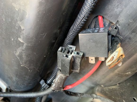 Relay zip tied to a bumper cover mount