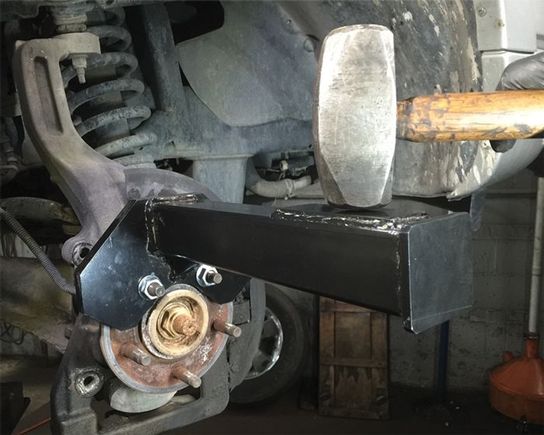 Like this hub buster , I recommend removing the axle nut first !