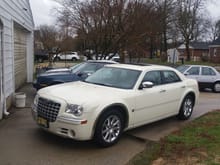 2007 Chrysler 300C and behind it, two of the 8th worst car ever built, according to multiple car magazines, Cadillac, Cimarrons, and a 2004 Dodge Intrepid.