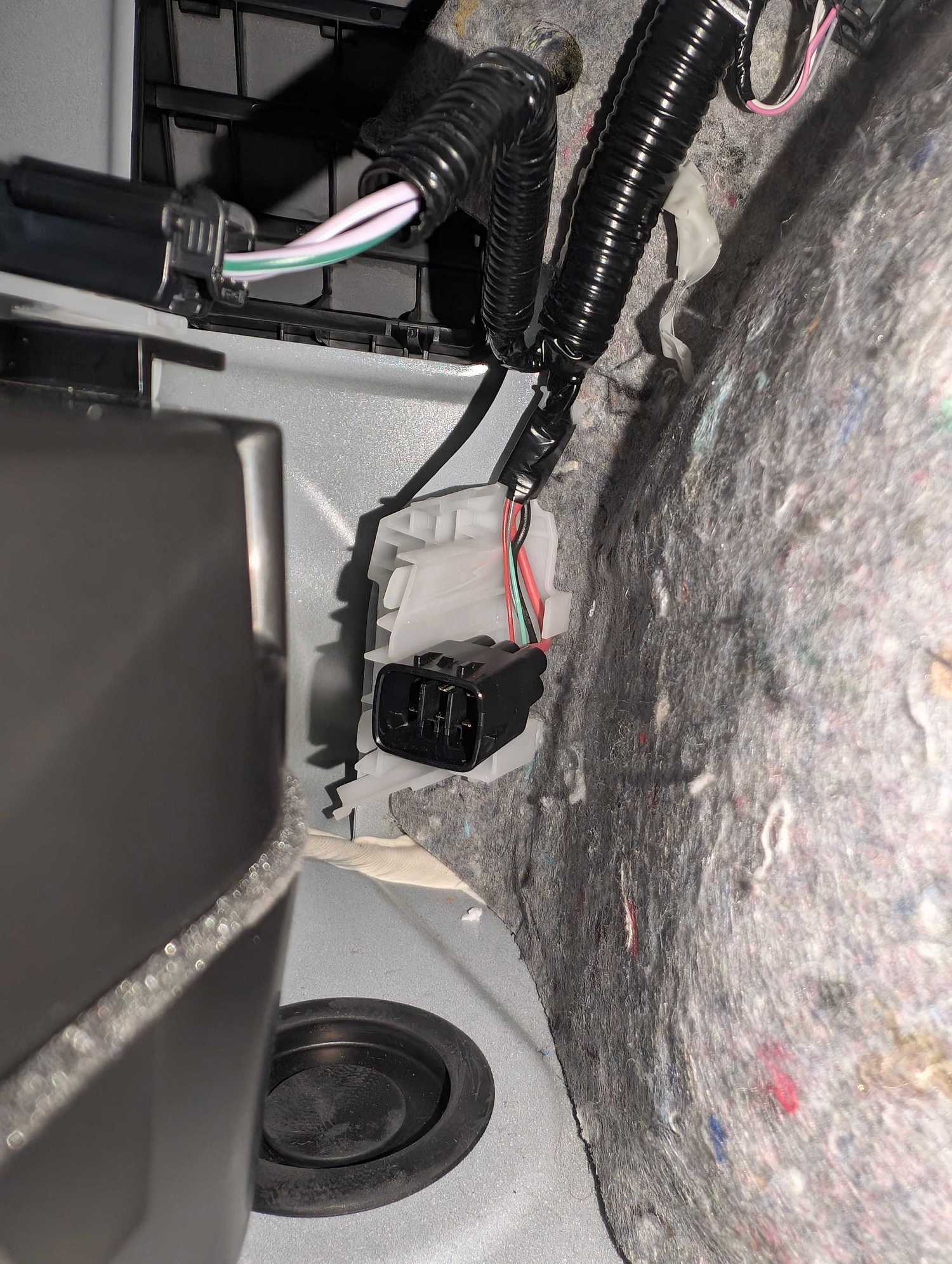 Socket behind factory pioneer subwoofer in boot