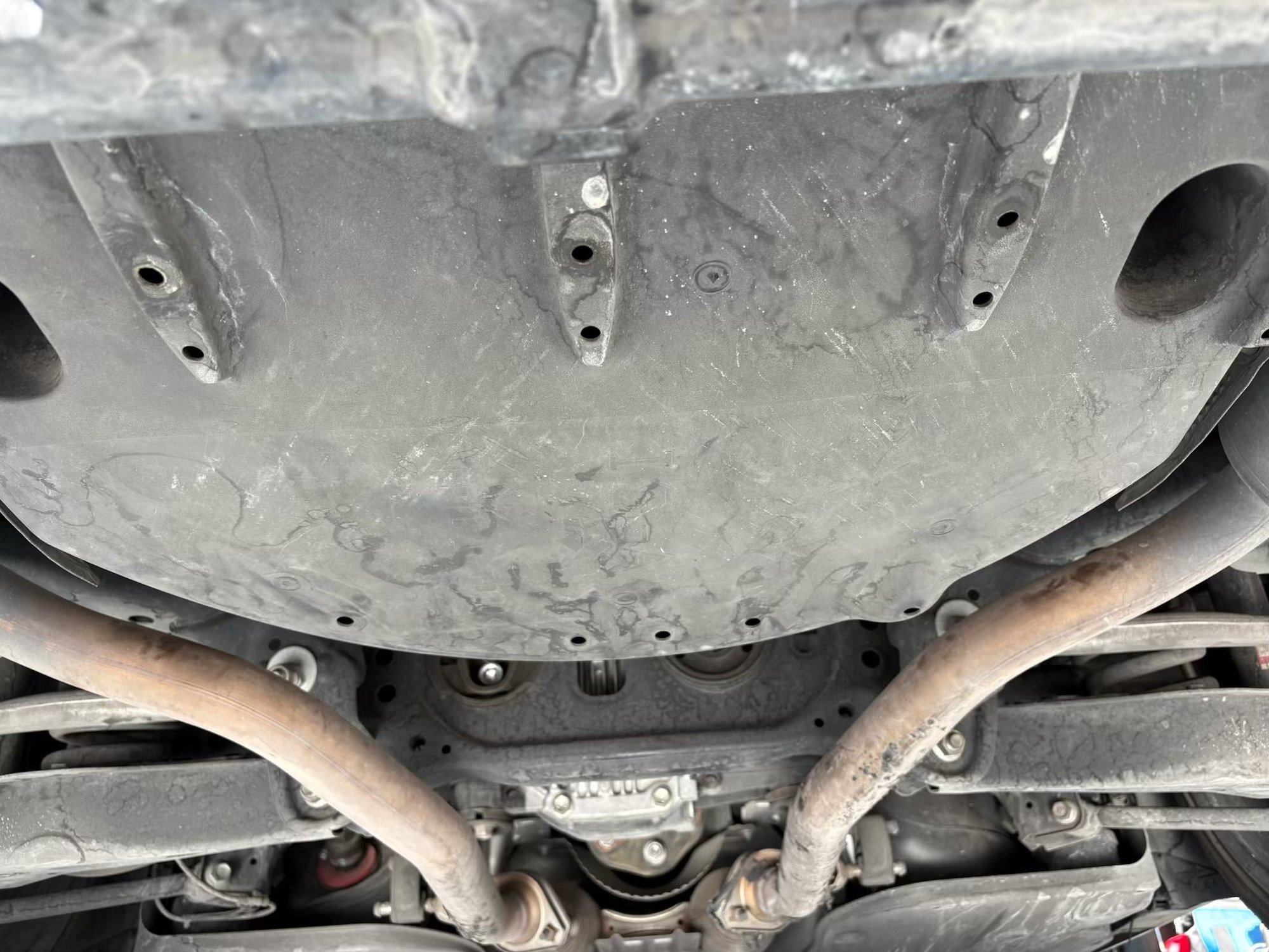 remove this skid plate, underneath the trunk, between mufflers and behind the rear Diff