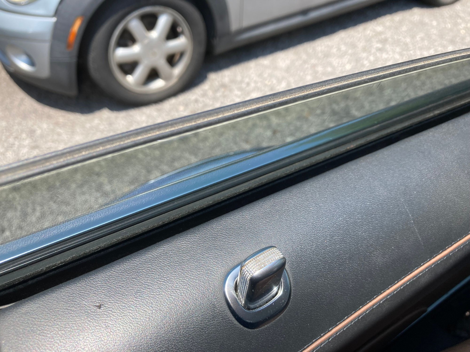 This car has extended leather and all the expected stuff like double plane glass etc, lock pulls are plastic for some reason 