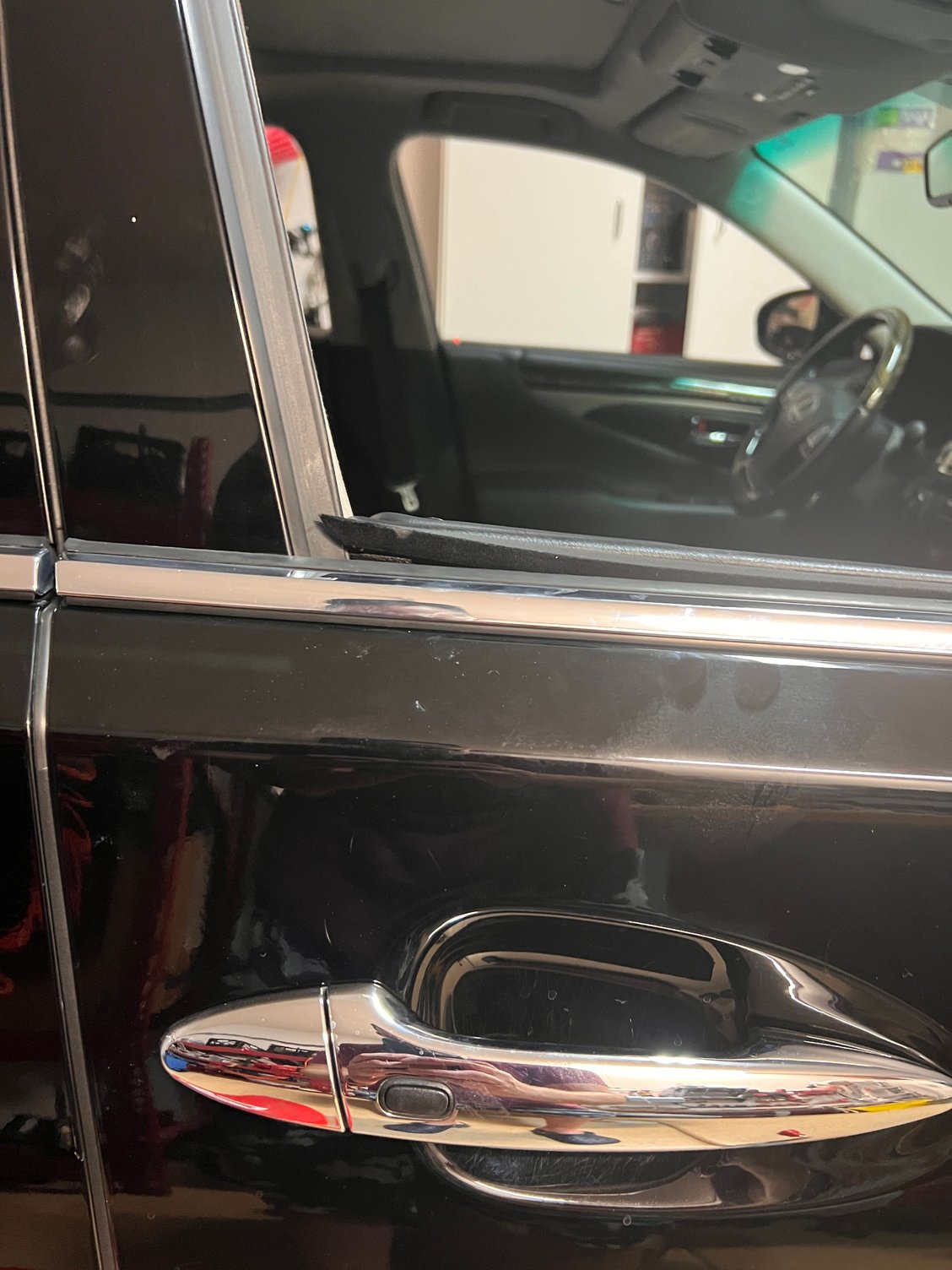 Notice how the top of the panel extends above the chrome finish on the door�s exterior. Looks wrong to me. 