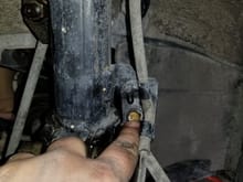 Undo this bolt to free the brake line from the strut.