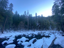 Snow capped rocks in the Merced River