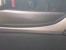 Pop off the cover to access this screw