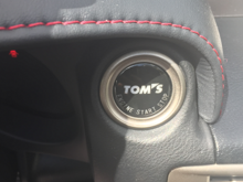Tom' push start. Easy install Pop the ring out with a really flat flat screw driver. pop the oem push start out there three clips holding it down be gentle not break anything than pop everything back in.