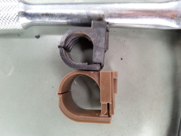 Another clamp is for wire loom that runs parallel  to valve cover and presses onto a  bracket. The tan clamp is incorrect part reveivef from dealer.
