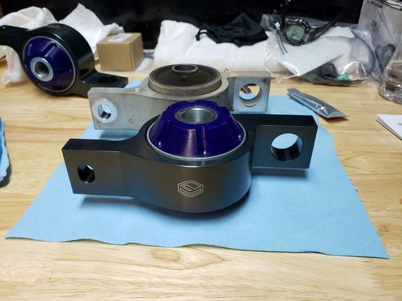 Figs and worn OEM bushings, nut side up.