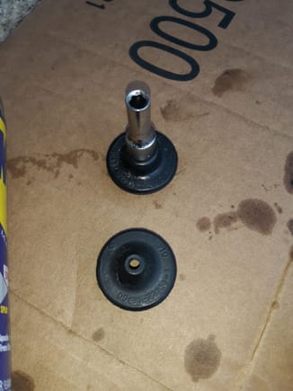 Used Toyota rubber grease to fit a small socket into the hole. As I found out, if you go too large, it will split grommet. But go slightly larger than hole and will help when attempting to fit over brake line nut.